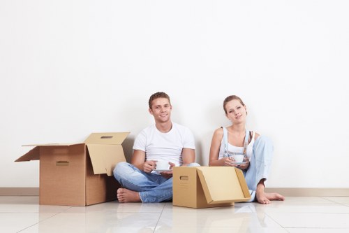 Local movers organizing household items for unpacking