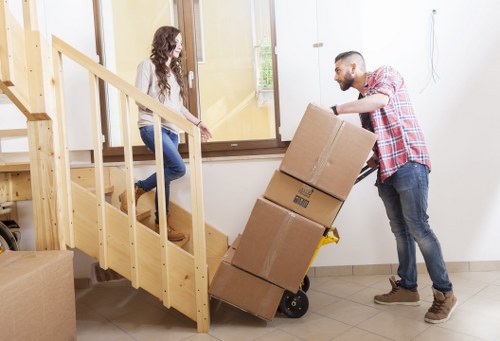 Packed boxes and furniture ready for removal in a Stockwell flat